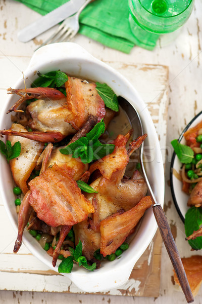 Roast quail with bacon, peas and mint Stock photo © zoryanchik
