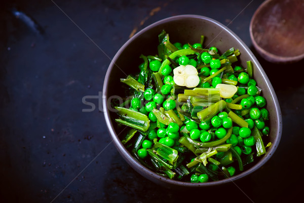 stewed green peas with fried eggs Stock photo © zoryanchik