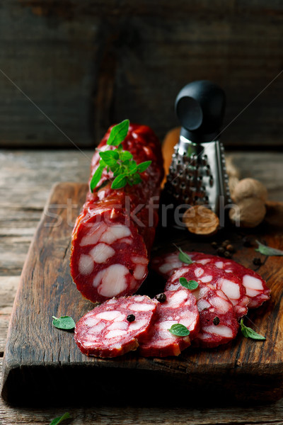 uncooked smoked sausage on a chopping board Stock photo © zoryanchik