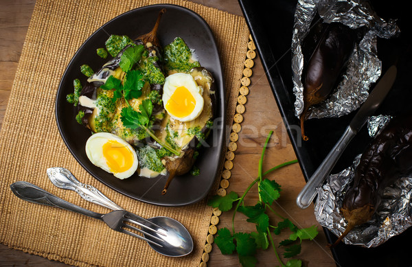 the baked eggplants with egg and two sauces Stock photo © zoryanchik