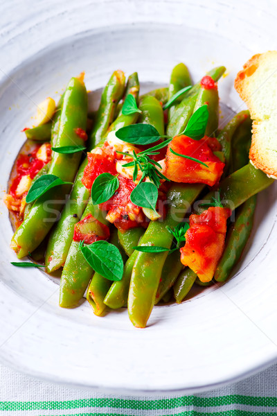 green beans, stewed with tomatoes. Stock photo © zoryanchik
