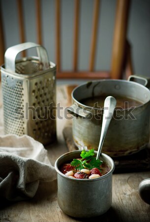 Sopa de feijão salsichas metal caneca estilo rústico Foto stock © zoryanchik