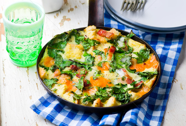 Stock photo: Skillet Strata with Bacon, Cheddar, and Greens 