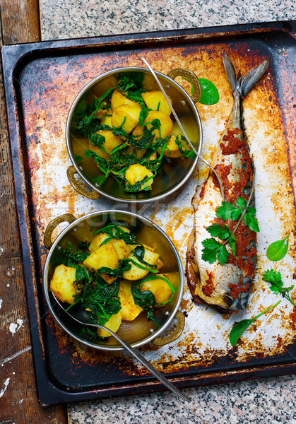 Stock photo: devilled mackerel with potatoes and spinach..style vintage 