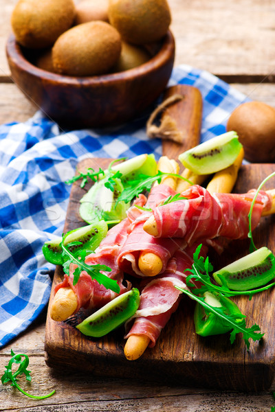 Prosciutto and kiwi.selective focus. Stock photo © zoryanchik