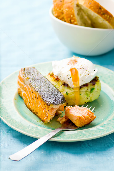 the fried salmon with a potato patty and poached egg  Stock photo © zoryanchik