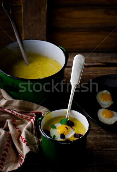 potato soup - mashed potatoes with fried eggs  Stock photo © zoryanchik