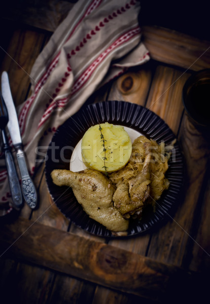 Confit from a duck, stewed sauerkraut and mashed potatoes.  Stock photo © zoryanchik