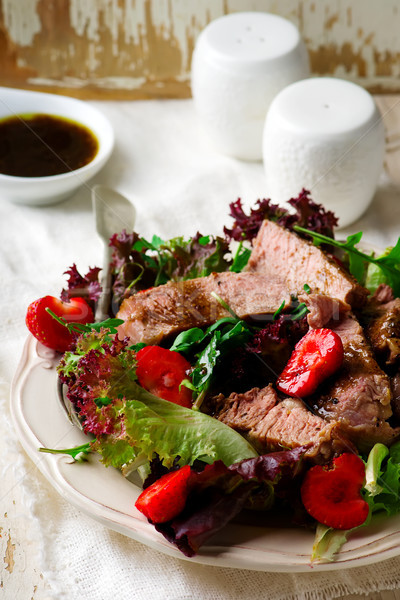 Steak and strawerry salad with Greens Stock photo © zoryanchik