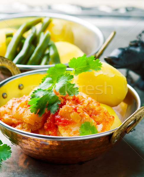 Poached Fish in Tomato Sauce Stock photo © zoryanchik