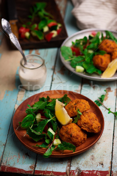  Beet falafel with tahina sauce and green salad  Stock photo © zoryanchik
