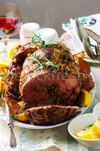 Stock photo: Roast lamb leg with Vegetables.style rustic.