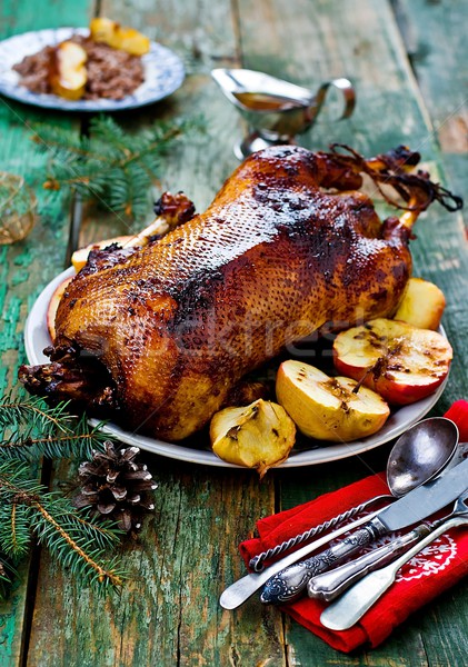the Christmas baked goose with apples Stock photo © zoryanchik