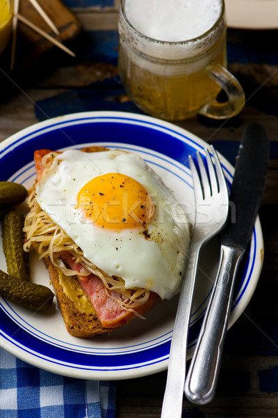 sandwich with sauerkraut , ham and fried eggs Stock photo © zoryanchik