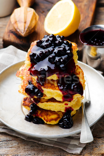 LEMON RICOTTA PANCAKES WITH BLUEBERRY SAUCE. Stock photo © zoryanchik