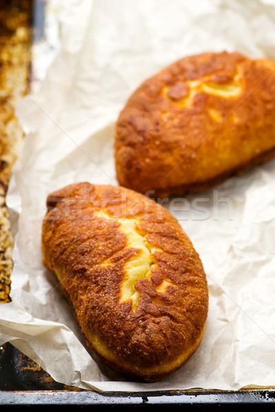 Stock photo: 	belyash ,yeast dough round pasty with meat filling .