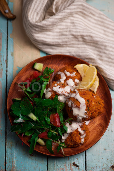  Beet falafel with tahina sauce and green salad  Stock photo © zoryanchik