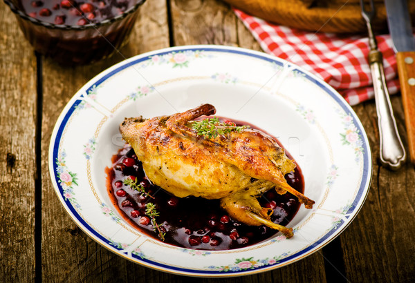 the baked quails with cowberry sauce Stock photo © zoryanchik