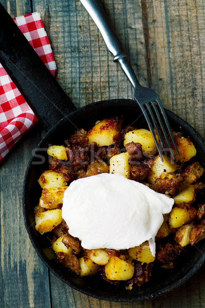 Hash brown in a frying pan. top view Stock photo © zoryanchik