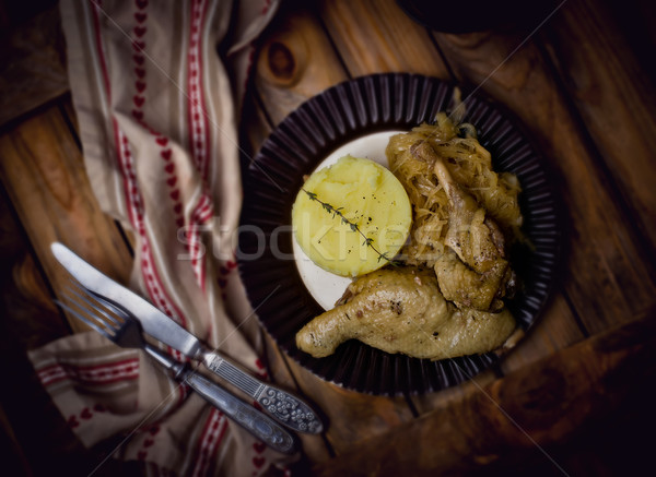 Confit from a duck, stewed sauerkraut and mashed potatoes.  Stock photo © zoryanchik