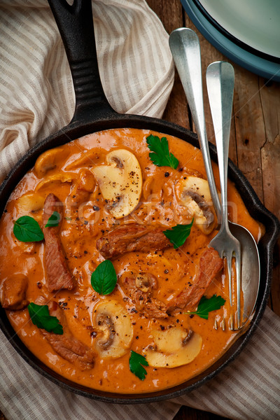 Beef Stroganoff with mushroom in iron pan Stock photo © zoryanchik