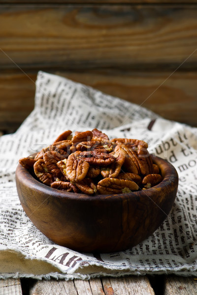 a pecan is in a wooden bowl. style rustic  Stock photo © zoryanchik