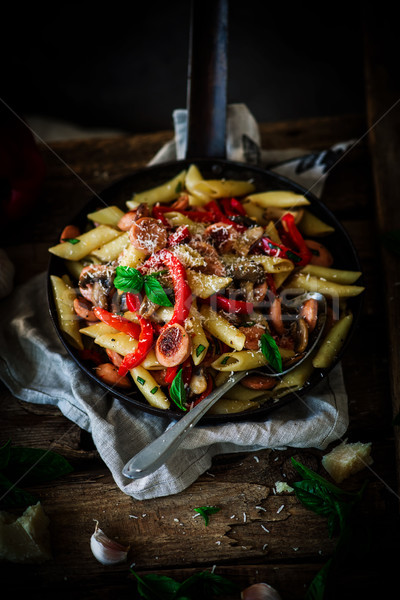Stock photo: Smoked Sausage Penne Pasta in the skillet