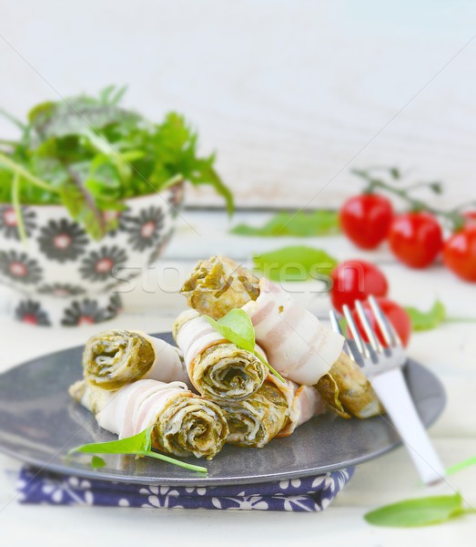 Rolls from an omelet with a sorrel and bacon  Stock photo © zoryanchik