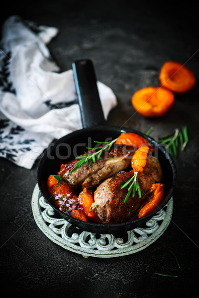 Stock photo: Duck breast with apricots . dark photo .style vintage