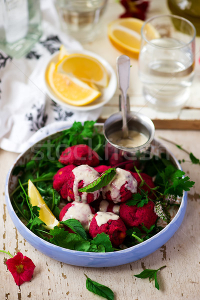  Beet falafel with tahina sauce and green salad  Stock photo © zoryanchik