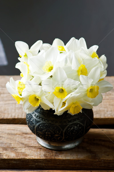 bouquet of narcissuses in vintage vase.style rustic Stock photo © zoryanchik