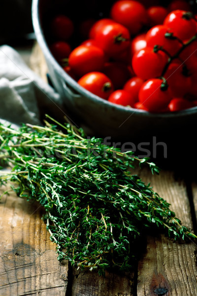Bunch of a fresh thyme on a wooden table Stock photo © zoryanchik