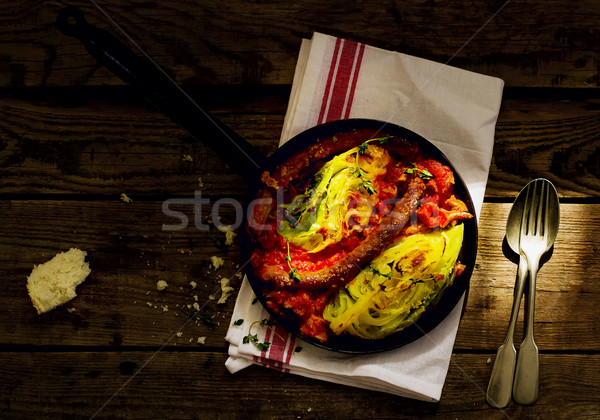 The baked cabbage with sausages  Stock photo © zoryanchik