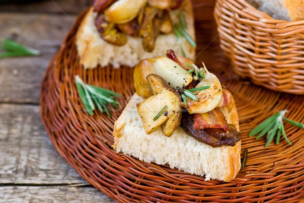 Fried cepes with bacon, garlic and rosemary Stock photo © zoryanchik