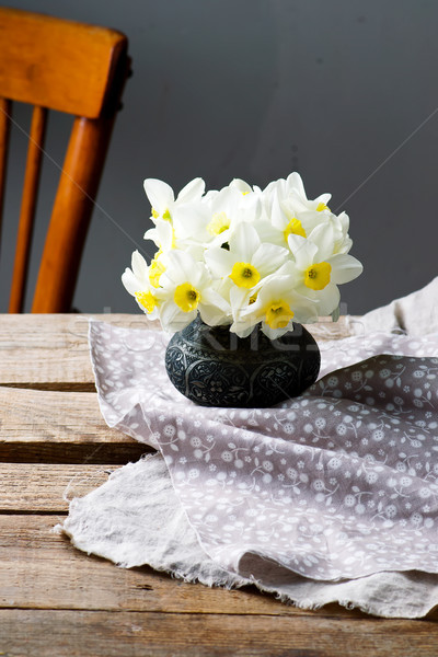 bouquet of narcissuses in vintage vase.style rustic Stock photo © zoryanchik