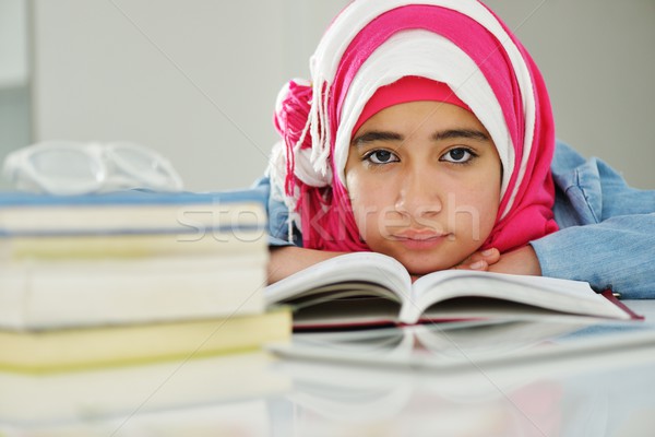 Portrait of beautiful Arabic Muslim girl with books Stock photo © zurijeta