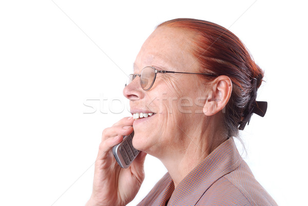 Middle aged woman talking on phone Stock photo © zurijeta