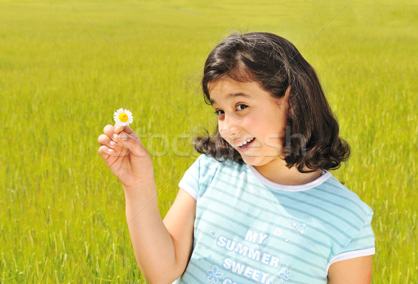 [[stock_photo]]: Fille · heureuse · fleur · blanche · souriant · extérieur · fleur · printemps