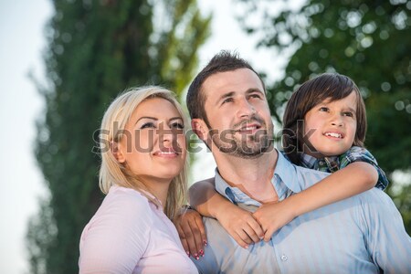 Smiling parents with kid Stock photo © zurijeta