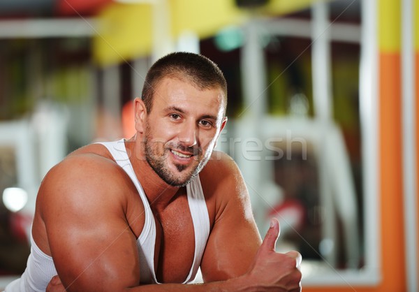 Athletic bodybuilder, execute exercise in sport gym hall Stock photo © zurijeta
