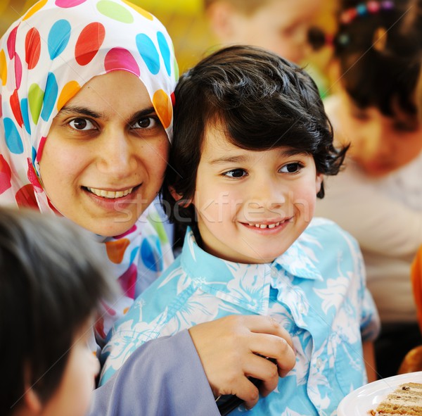 Muslim Arabic mother with children having fun at birthday party Stock photo © zurijeta