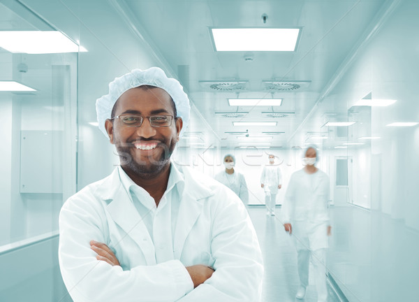 Working people with white uniforms in modern facility Stock photo © zurijeta