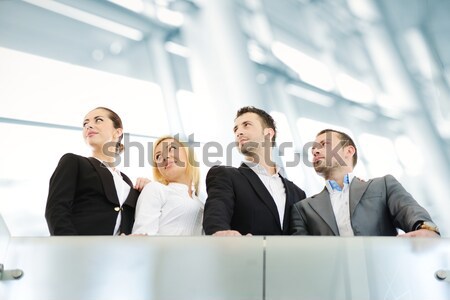 Successful business people on railing Stock photo © zurijeta