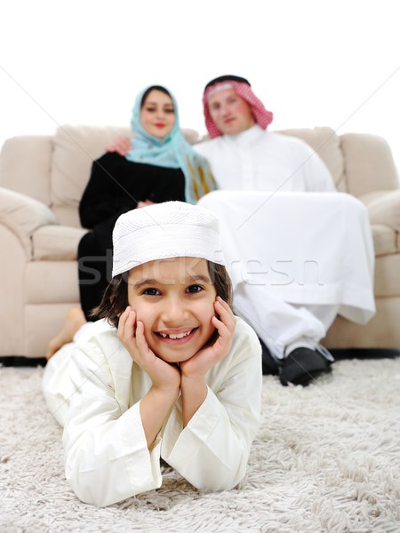 Happy Middle eastern on sofa Stock photo © zurijeta