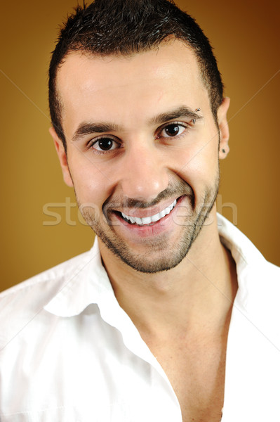 Portrait of a handsome young man on colored background with vignette  Stock photo © zurijeta