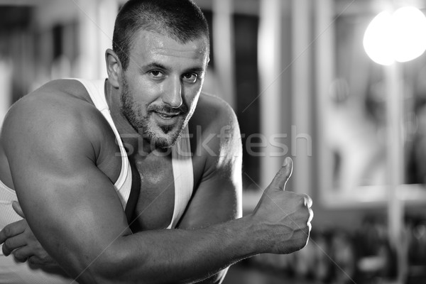 Athletic bodybuilder, execute exercise in sport gym hall Stock photo © zurijeta