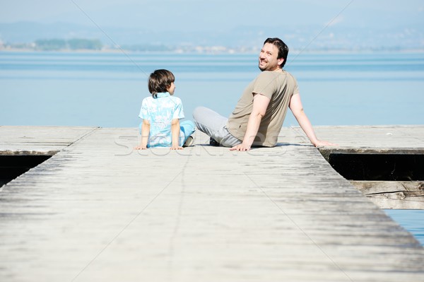 Vater-Sohn Dock schönen See Meer Strand Stock foto © zurijeta