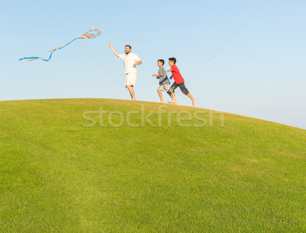 Running with kite on summer holiday vacation, perfect meadow and Stock photo © zurijeta