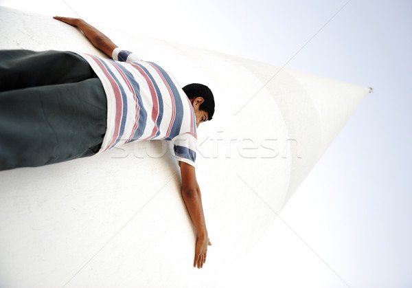 A human holding giant pillar, small and big, low and high Stock photo © zurijeta