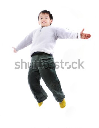 Adorable child jumping a over white background Stock photo © zurijeta